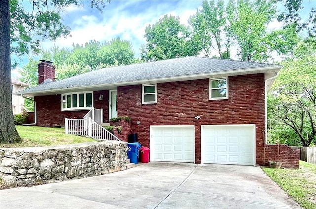 11510 Ridge Dr, Sugar Creek, MO 64054 - ranch-style house with an attached garage, a chimney, driveway, and brick siding