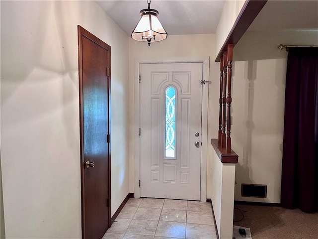 11510 Ridge Dr, Sugar Creek, MO 64054 - entryway featuring baseboards and light tile patterned floors