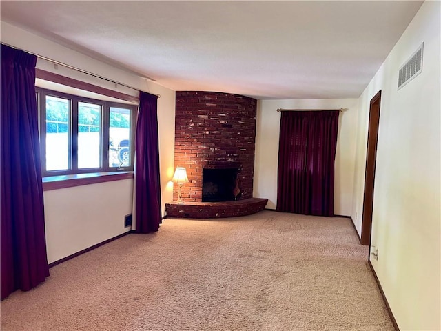 11510 Ridge Dr, Sugar Creek, MO 64054 - unfurnished living room with carpet flooring and a brick fireplace
