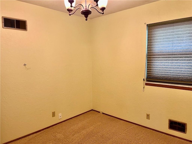 11510 Ridge Dr, Sugar Creek, MO 64054 - carpeted empty room with a chandelier and baseboards