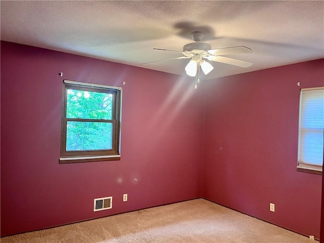 11510 Ridge Dr, Sugar Creek, MO 64054 - unfurnished room featuring carpet, a ceiling fan, and a textured ceiling