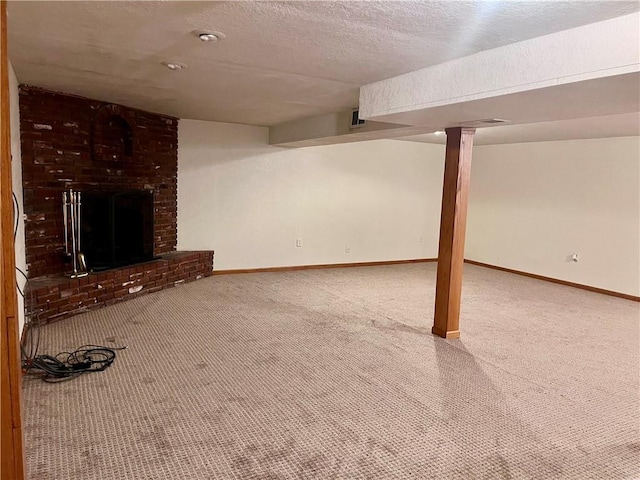 11510 Ridge Dr, Sugar Creek, MO 64054 - finished below grade area with carpet, a fireplace, and a textured ceiling