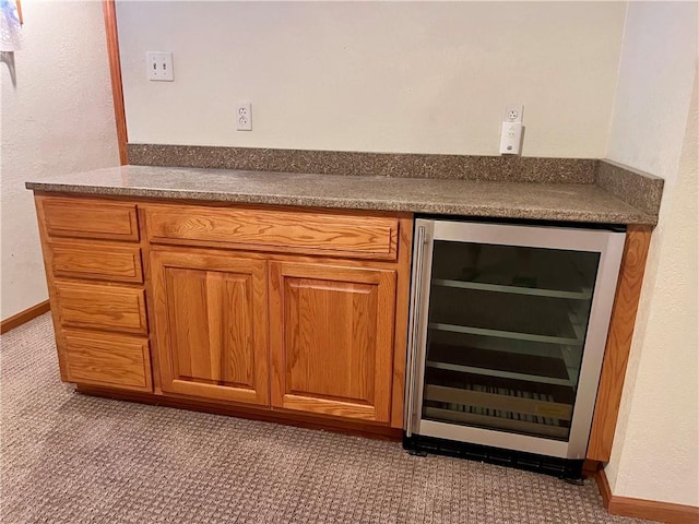 11510 Ridge Dr, Sugar Creek, MO 64054 - bar featuring wine cooler and baseboards