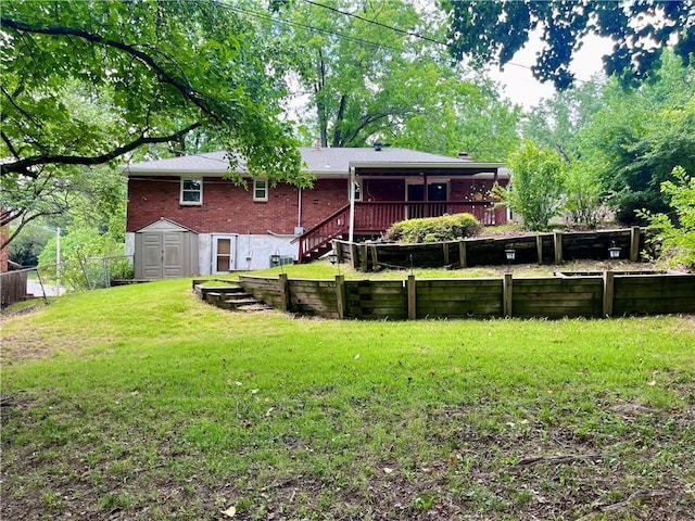 11510 Ridge Dr, Sugar Creek, MO 64054 - back of house with brick siding, a shed, a fenced backyard, stairs, and a deck