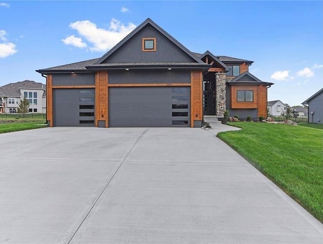 16377 W 166th Pl, Olathe, KS 66062 - view of front of home featuring an attached garage, concrete driveway, and a front yard