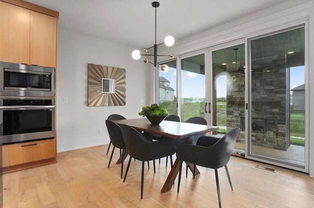 16377 W 166th Pl, Olathe, KS 66062 - dining space featuring light wood-style floors and baseboards