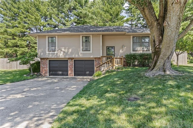 1413 SE 1st Ter, Lees Summit, MO 64063 - bi-level home with brick siding, an attached garage, and driveway