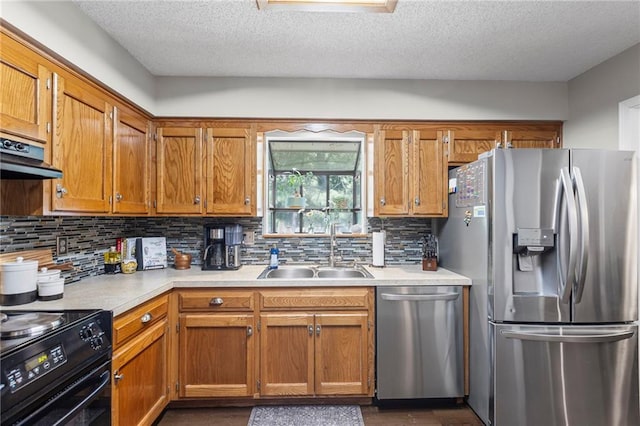 1413 SE 1st Ter, Lees Summit, MO 64063 - kitchen featuring appliances with stainless steel finishes, light countertops, tasteful backsplash, a textured ceiling, and extractor fan