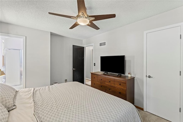 1413 SE 1st Ter, Lees Summit, MO 64063 - bedroom featuring light colored carpet, a textured ceiling, and ceiling fan
