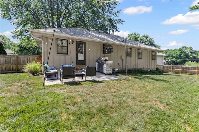 1413 SE 1st Ter, Lees Summit, MO 64063 - back of house featuring board and batten siding, a fenced backyard, a patio area, and an outdoor hangout area