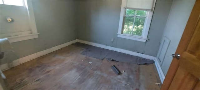 214 S Ridgeview Rd, Olathe, KS 66061 - empty room with baseboards and wood finished floors