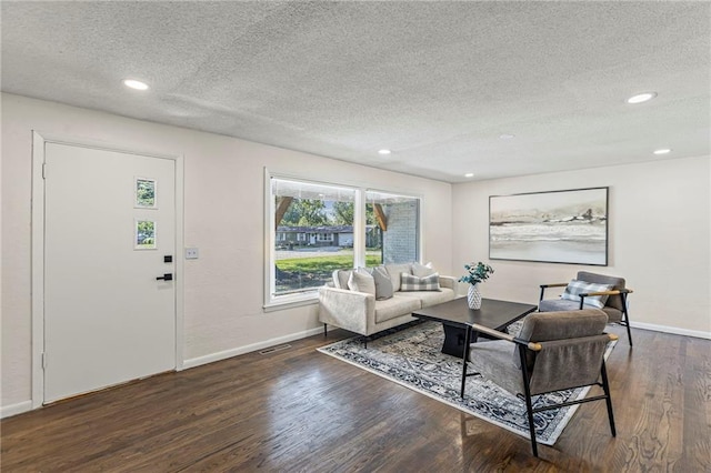 2 Overhill Dr, Paola, KS 66071 - living room featuring a textured ceiling, wood finished floors, and recessed lighting