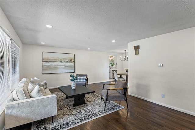 2 Overhill Dr, Paola, KS 66071 - living room featuring a textured ceiling, wood finished floors, recessed lighting, and a chandelier