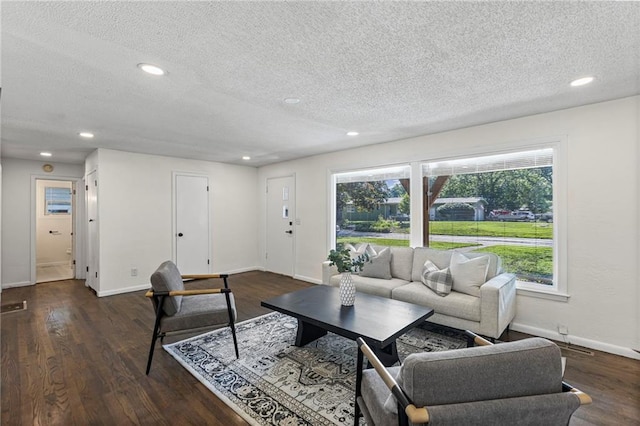 2 Overhill Dr, Paola, KS 66071 - living room featuring a textured ceiling, recessed lighting, and dark wood finished floors