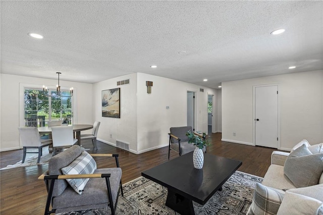 2 Overhill Dr, Paola, KS 66071 - living area featuring a textured ceiling, wood finished floors, a chandelier, and recessed lighting