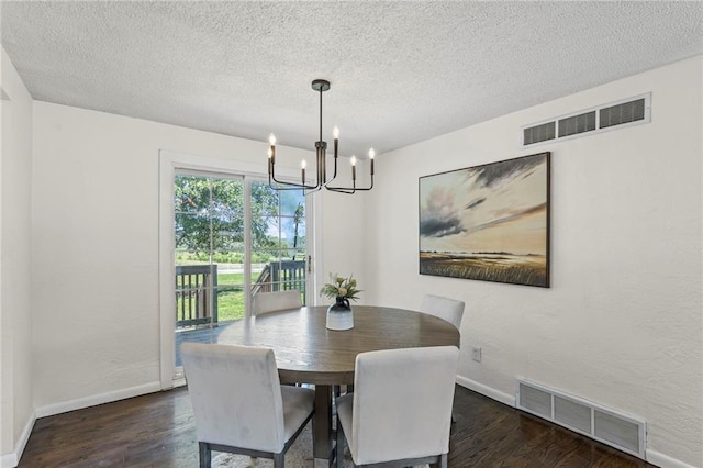 2 Overhill Dr, Paola, KS 66071 - dining space featuring a chandelier, wood finished floors, and a textured ceiling