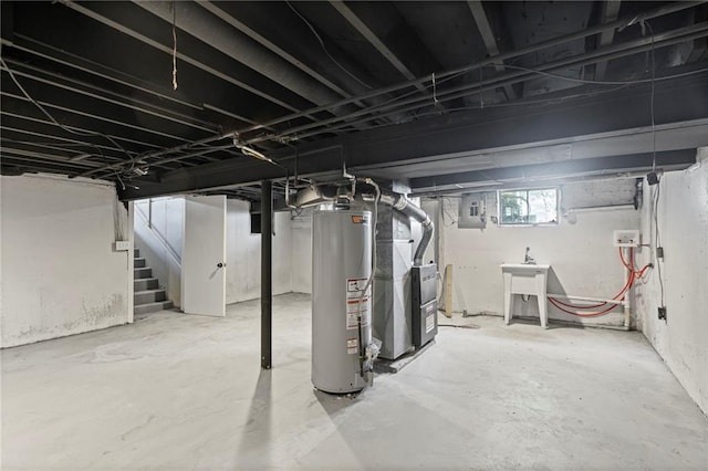 2 Overhill Dr, Paola, KS 66071 - below grade area featuring gas water heater, stairway, and electric panel