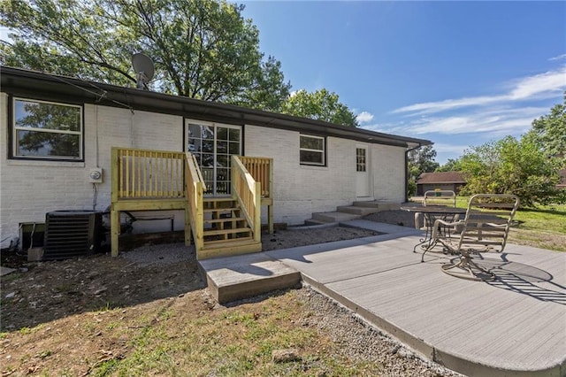 2 Overhill Dr, Paola, KS 66071 - rear view of property featuring brick siding and a deck