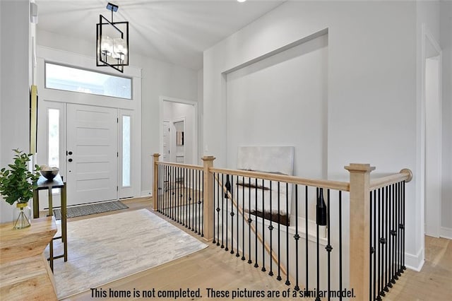 11275 S Gleason Rd, Olathe, KS 66061 - entrance foyer featuring wood finished floors and a chandelier