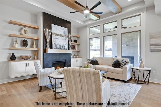 11275 S Gleason Rd, Olathe, KS 66061 - living room with ceiling fan, a fireplace, and light wood-style flooring