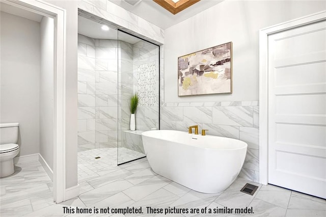 11275 S Gleason Rd, Olathe, KS 66061 - full bath with marble finish floors, a freestanding tub, and a walk in shower