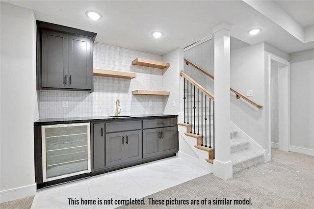 11275 S Gleason Rd, Olathe, KS 66061 - indoor wet bar with beverage cooler, stairs, decorative backsplash, recessed lighting, and light colored carpet