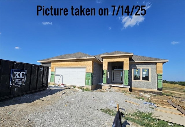 11275 S Gleason Rd, Olathe, KS 66061 - view of front facade featuring a garage and driveway