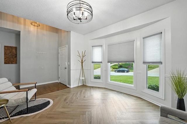 5136 NE Ash Grove Dr, Lees Summit, MO 64064 - living area with a chandelier and baseboards