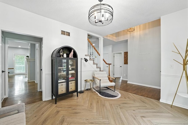 5136 NE Ash Grove Dr, Lees Summit, MO 64064 - living area with a chandelier and stairway