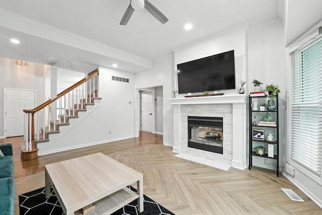 5136 NE Ash Grove Dr, Lees Summit, MO 64064 - living area with ceiling fan, healthy amount of natural light, stairs, recessed lighting, and a multi sided fireplace