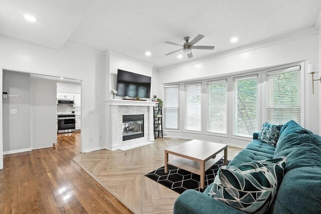 5136 NE Ash Grove Dr, Lees Summit, MO 64064 - living room with a ceiling fan, ornamental molding, recessed lighting, and a tile fireplace