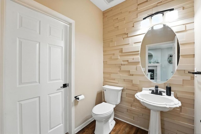 5136 NE Ash Grove Dr, Lees Summit, MO 64064 - half bathroom featuring wood finished floors and toilet