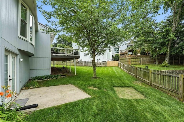 5136 NE Ash Grove Dr, Lees Summit, MO 64064 - fenced backyard with a patio, a deck, and french doors
