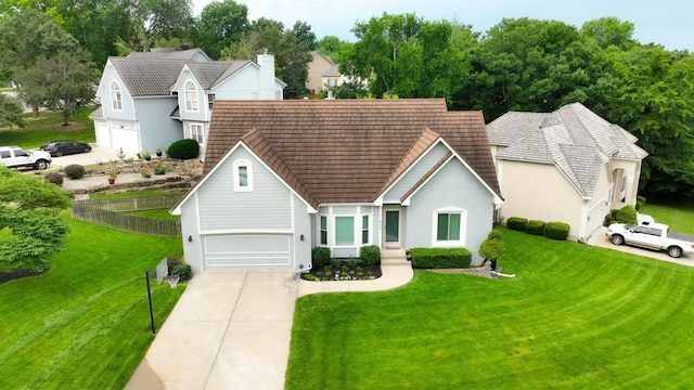 5136 NE Ash Grove Dr, Lees Summit, MO 64064 - traditional home featuring driveway, stucco siding, and a garage