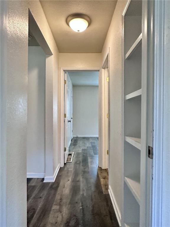 400 Webster St, Chillicothe, MO 64601 - corridor with dark wood-style flooring and built in shelves