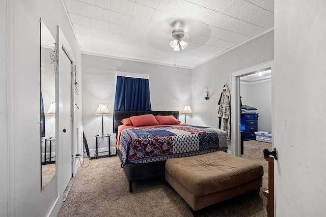 1312 N Main St, Nevada, MO 64772 - carpeted bedroom featuring crown molding and ceiling fan