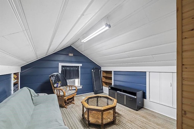 1312 N Main St, Nevada, MO 64772 - interior space featuring light carpet, vaulted ceiling, and wood walls