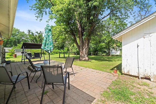 1312 N Main St, Nevada, MO 64772 - view of patio featuring outdoor dining area