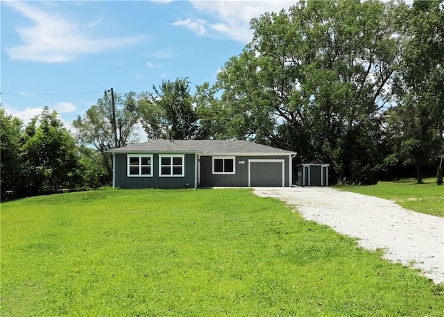 901 School Rd, Peculiar, MO 64078 - ranch-style house with gravel driveway, a garage, and a front lawn