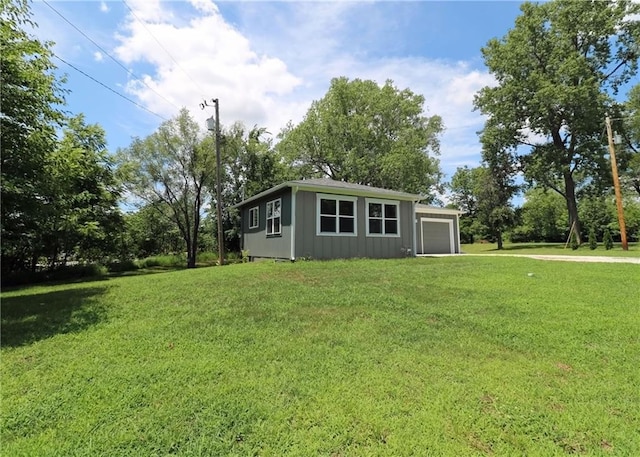 901 School Rd, Peculiar, MO 64078 - view of front facade featuring an attached garage, a front lawn, and driveway