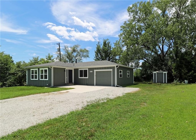 901 School Rd, Peculiar, MO 64078 - single story home featuring an attached garage, driveway, and a front lawn