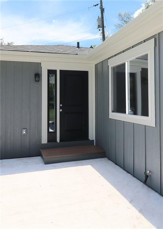 901 School Rd, Peculiar, MO 64078 - doorway to property with roof with shingles