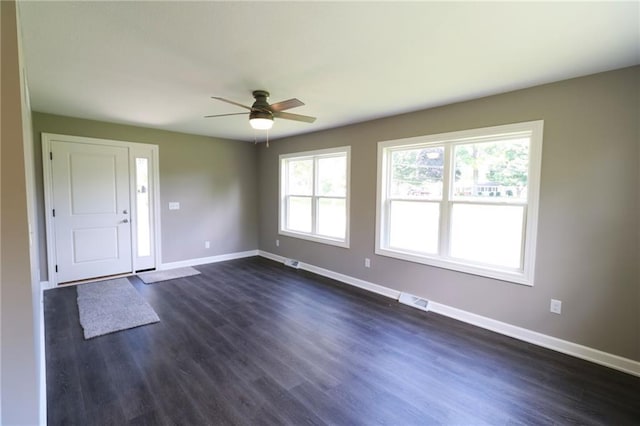 901 School Rd, Peculiar, MO 64078 - empty room featuring ceiling fan and dark wood finished floors