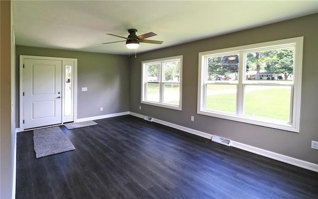 901 School Rd, Peculiar, MO 64078 - unfurnished room featuring plenty of natural light, ceiling fan, and dark wood-type flooring