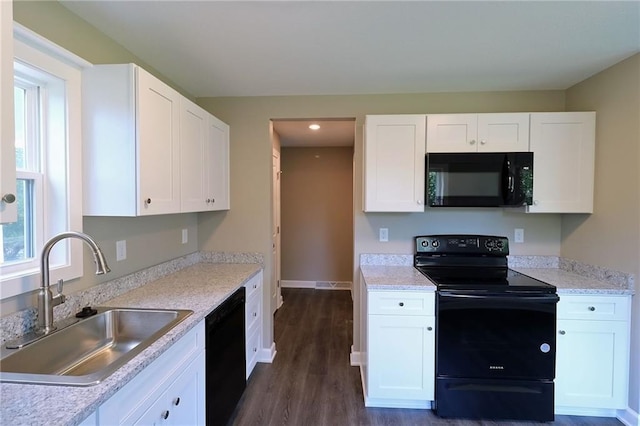 901 School Rd, Peculiar, MO 64078 - kitchen with black appliances, white cabinetry, light countertops, dark wood-style flooring, and recessed lighting