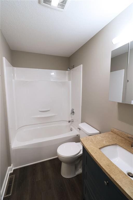 901 School Rd, Peculiar, MO 64078 - full bathroom with wood finished floors, vanity, and shower / bath combination