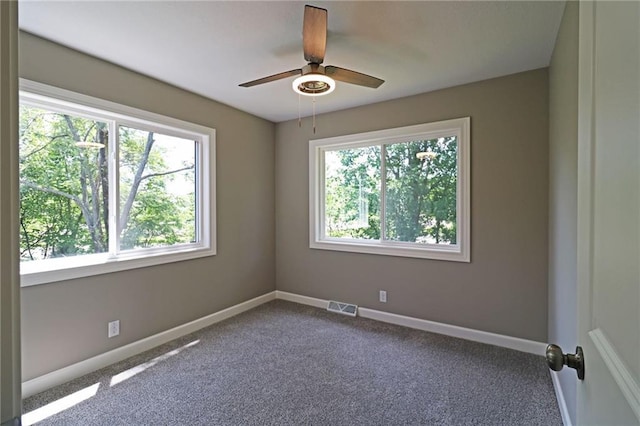 901 School Rd, Peculiar, MO 64078 - empty room with ceiling fan and carpet floors