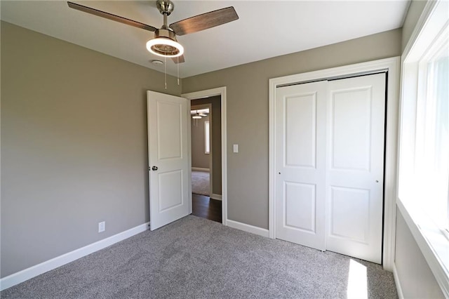 901 School Rd, Peculiar, MO 64078 - unfurnished bedroom with carpet, a closet, and ceiling fan