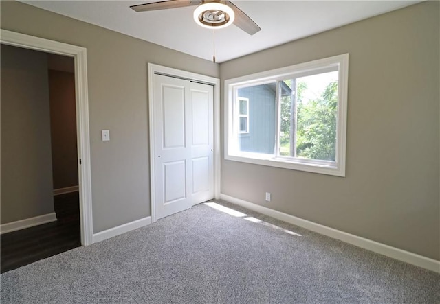 901 School Rd, Peculiar, MO 64078 - unfurnished bedroom featuring carpet flooring, a closet, and ceiling fan