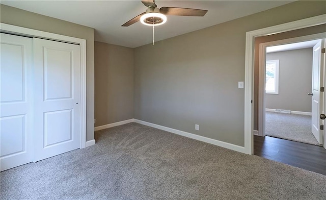 901 School Rd, Peculiar, MO 64078 - unfurnished bedroom with carpet, a closet, and ceiling fan